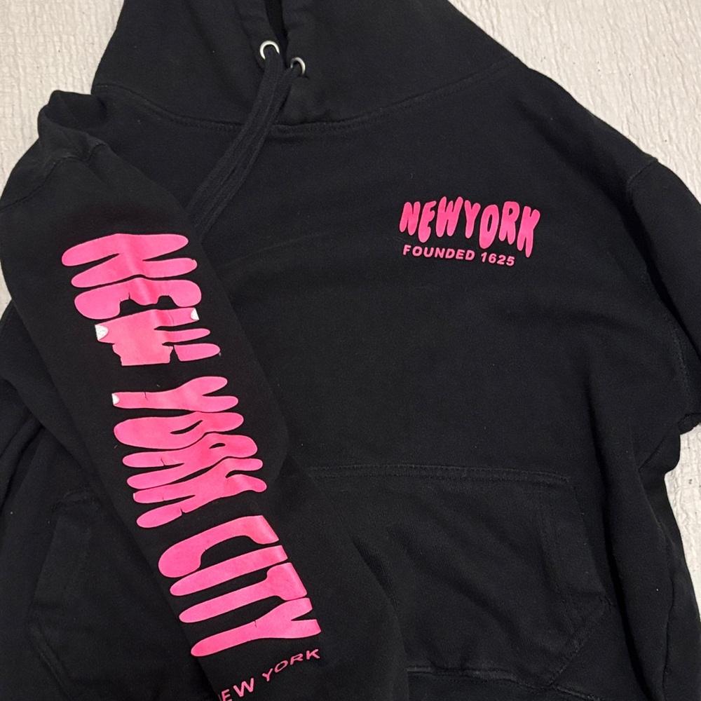 Black Hoodie with Pink New York Print (has a little peeling on the sleeve)